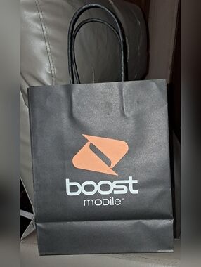 BOOST MOBILE BLACK PAPER BAGBOOST MOBILE BLACK PAPER BAG. About 8W x 10H x 3 7/8